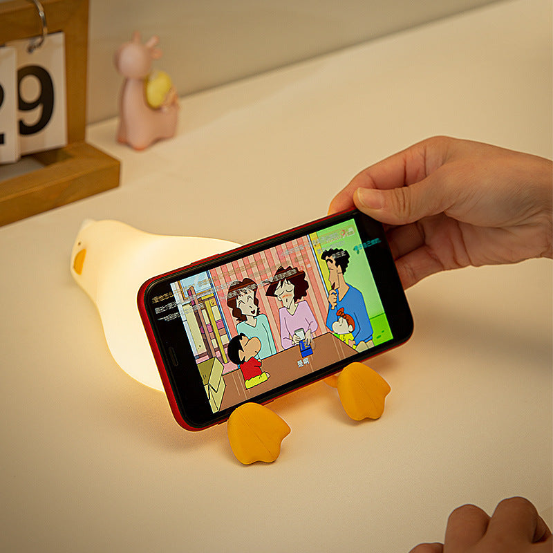 Fun lying flat duck turning over duck silicone night light creative silicone LED night light charging model fun phone holder